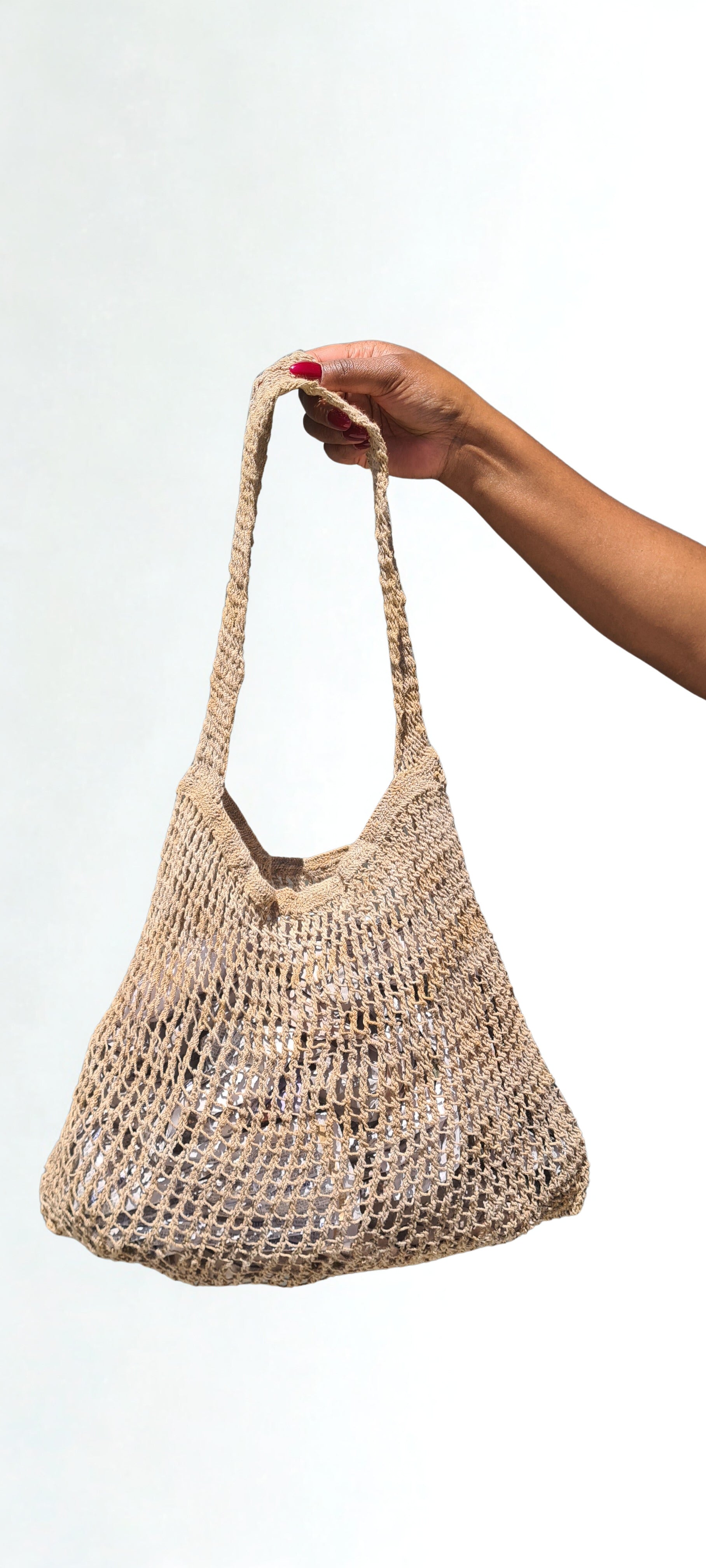 Handmade Natural Fibre Tulip Bilum Bag with Beige pattern on light background, Hanging Front view