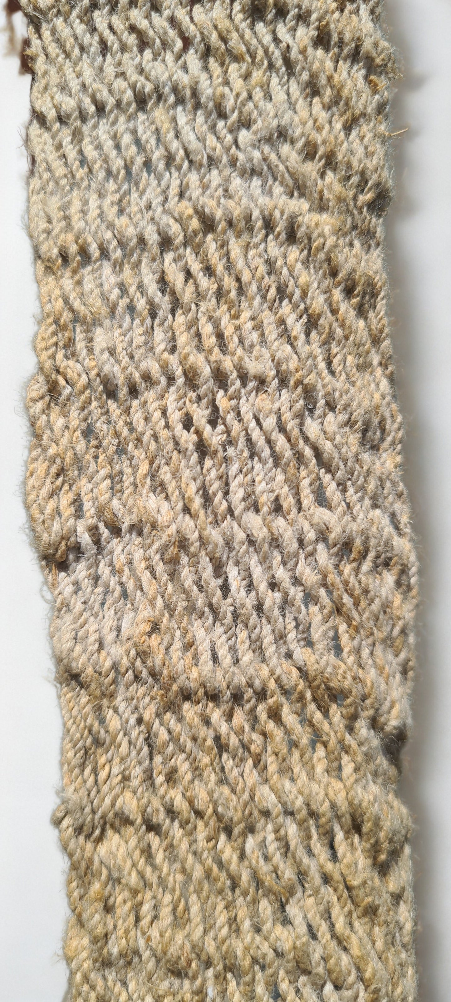 Handmade Natural Fibre Tulip Bilum Bag with Beige pattern on light background, Handle Close Up view