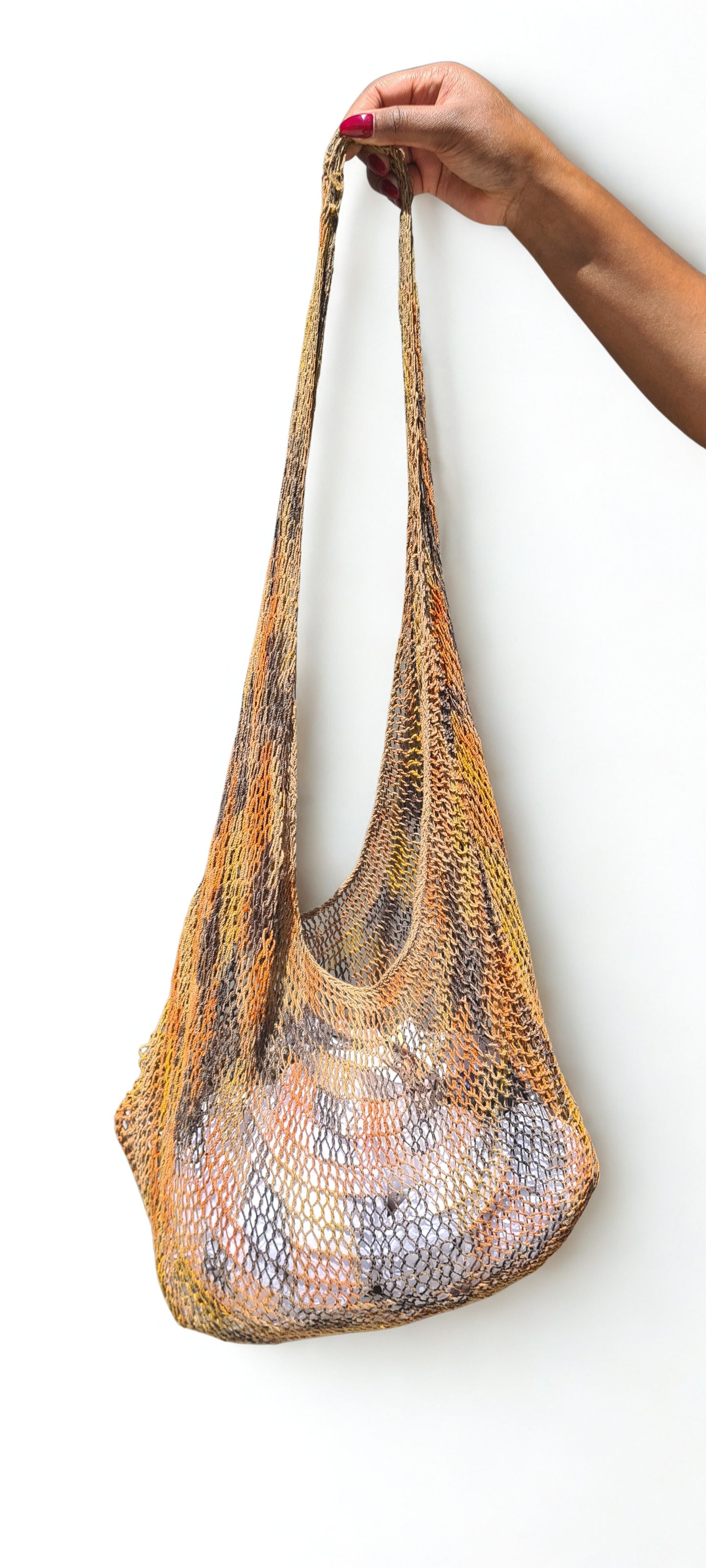 Handmade Natural Fibre Tulip Bilum Bag with Charcoal multicolour pattern on light background, Hanging Front View