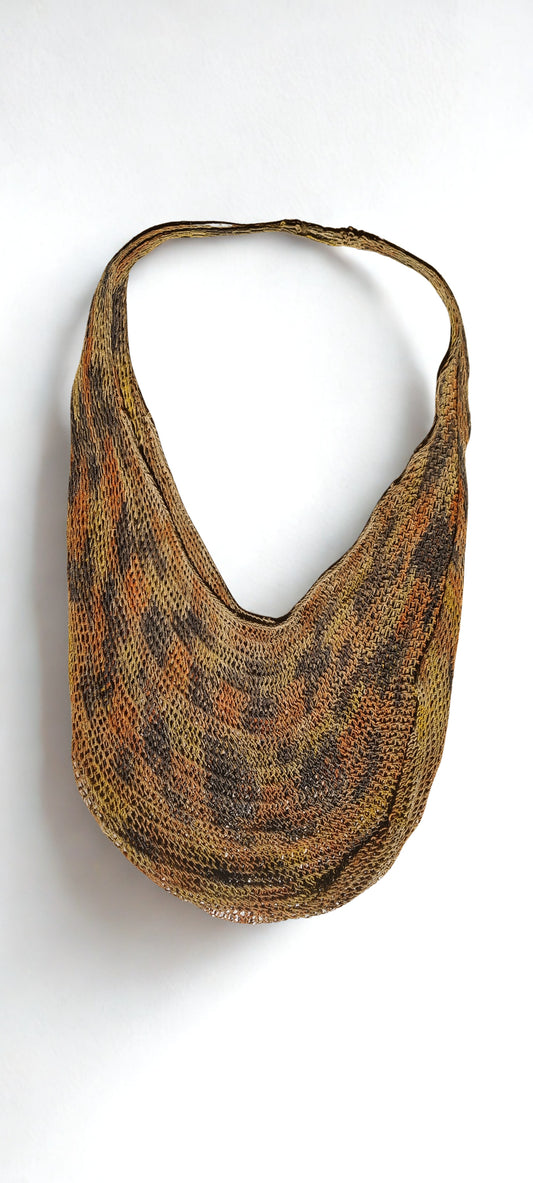Handmade Natural Fibre Tulip Bilum Bag with Charcoal multicolour pattern on light background, Flat Lay Front view